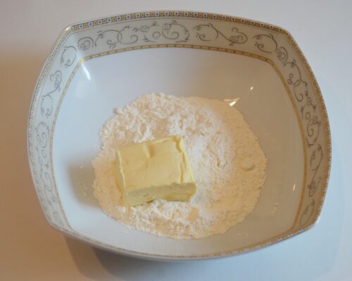 In a bowl, combine the flour and softened butter