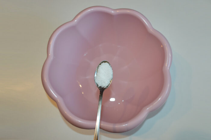 Pour warm water into a bowl and add salt