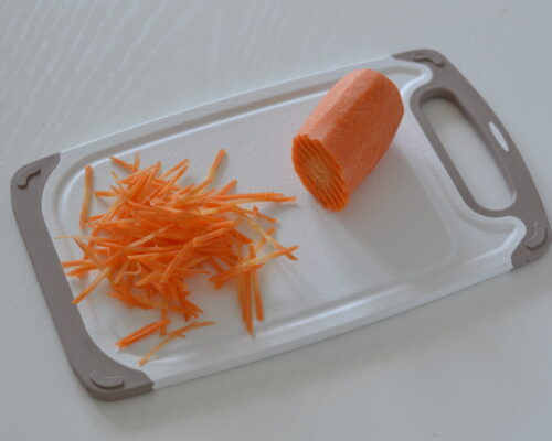 Peel the carrots and grate them using a Korean carrot grater