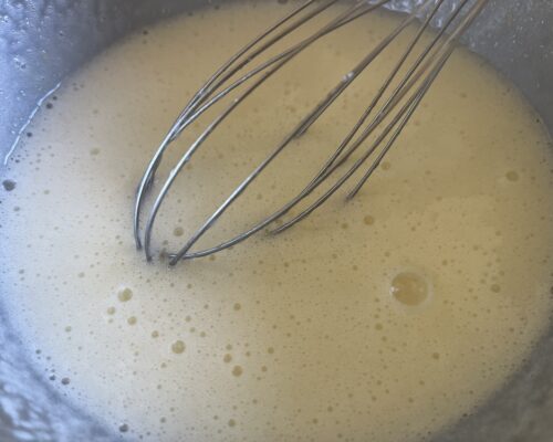 Lightly beat the eggs with the sugar