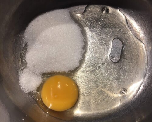 Grind the egg and sugar together