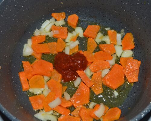 Add the tomato paste and stir