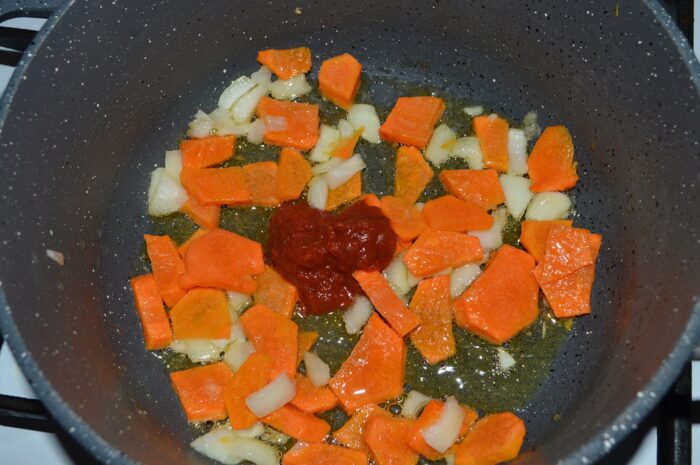 Add the tomato paste and stir