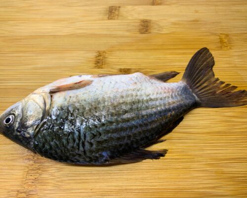 Remove the scales from the carp