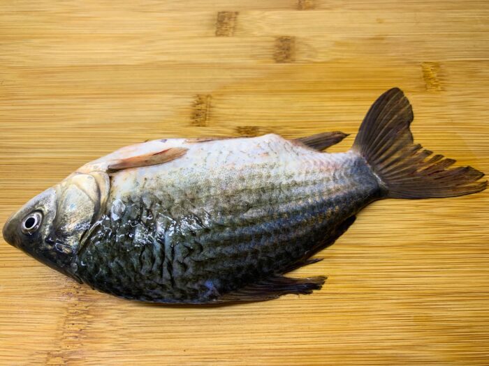 Remove the scales from the carp