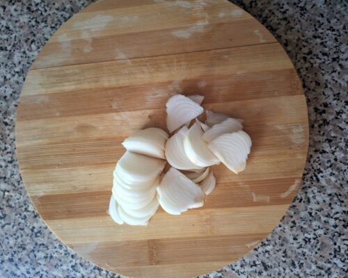 Cut the onion into half rings