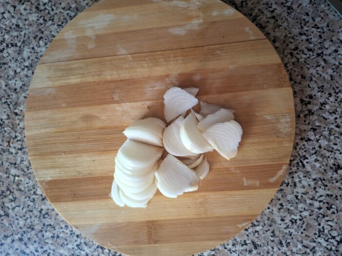 Cut the onion into half rings