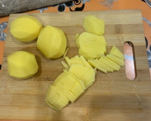 Peel the potatoes and cut