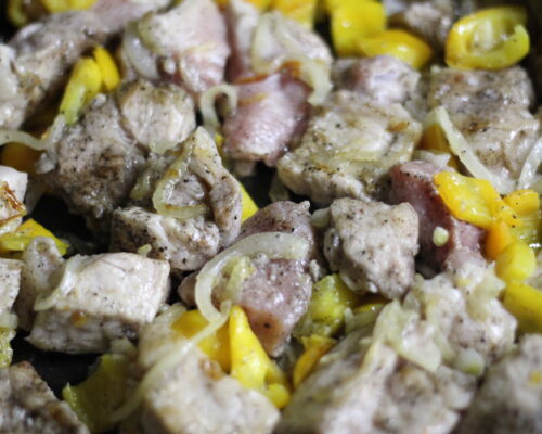 Add the pork to the vegetables and fry