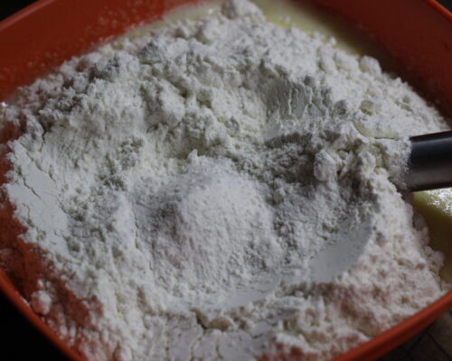 Add the baking powder and flour