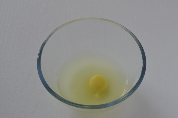 Add the egg to the warm whey