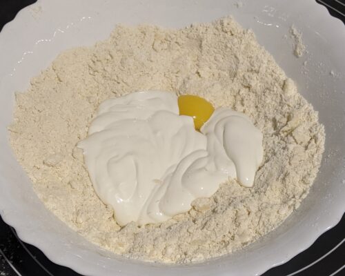 add the egg yolks and sour cream
