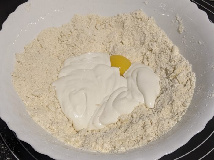 add the egg yolks and sour cream