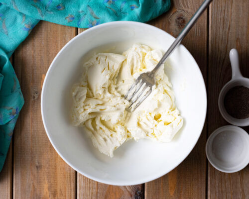 Place the cream cheese in a large bowl