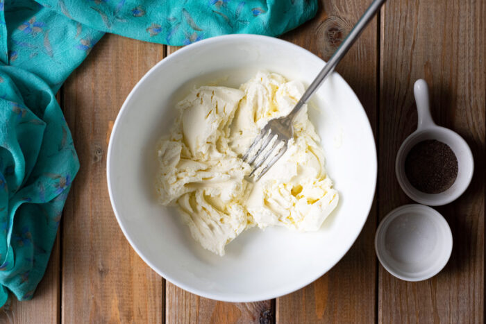 Place the cream cheese in a large bowl