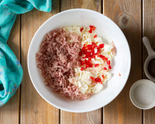 Add the chopped ham and jalapeño pepper to the cream cheese