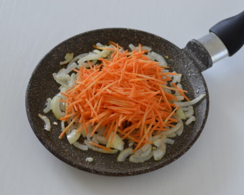 Add the grated carrots to the pan