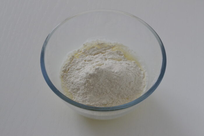 Add the sifted flour