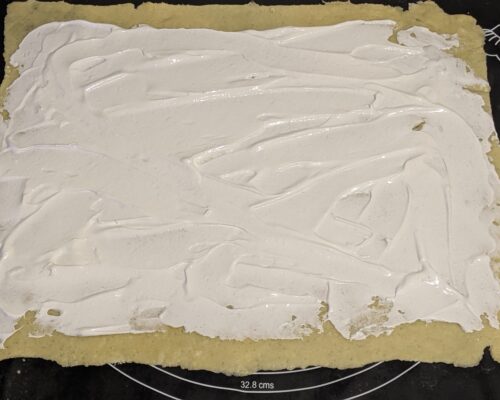 Spread the cream mixture over the dough