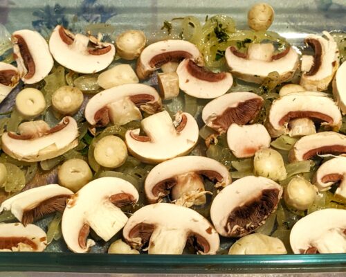 Place half of the onions and mushrooms