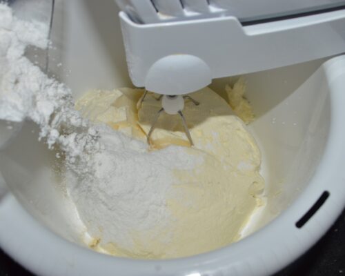 put the cream in a bowl and add the powdered sugar