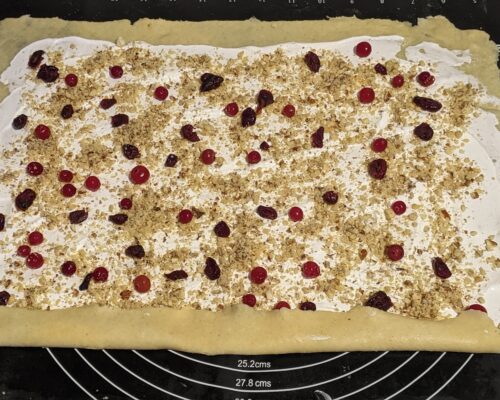 Sprinkle with walnuts and cranberries