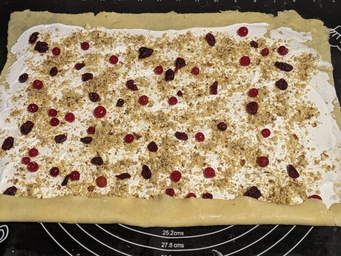 Sprinkle with walnuts and cranberries