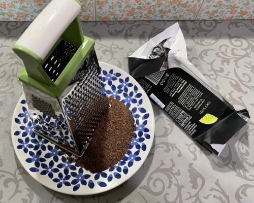 Cool the dark chocolate and grate i