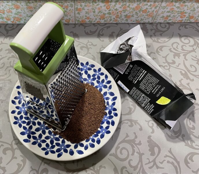 Cool the dark chocolate and grate i