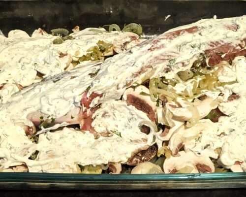 Coat the fish with a mixture of sour cream