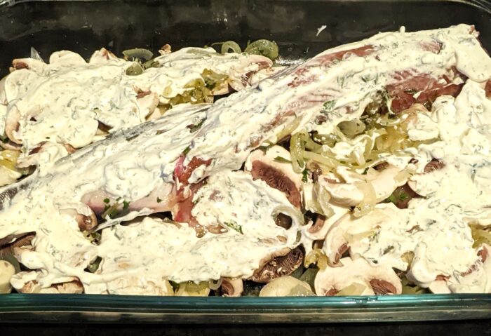 Coat the fish with a mixture of sour cream