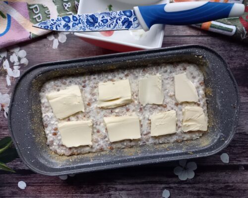 Spread thin slices of butter on top