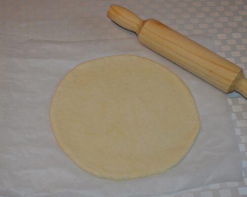 roll out the dough into a round shape