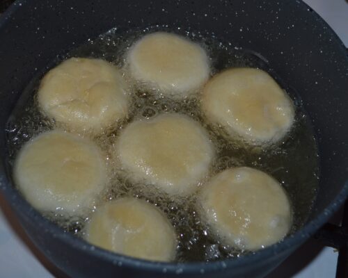 add the doughnuts and reduce the heat