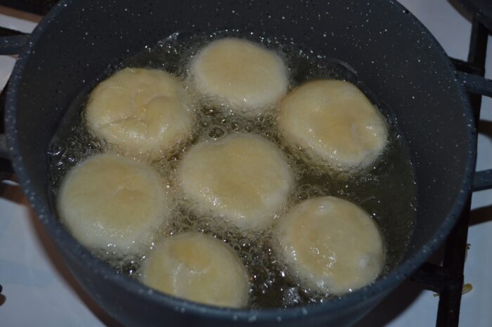 add the doughnuts and reduce the heat