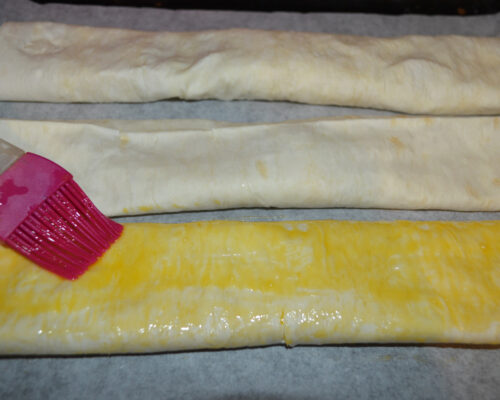 Grease the rolls with egg yolk