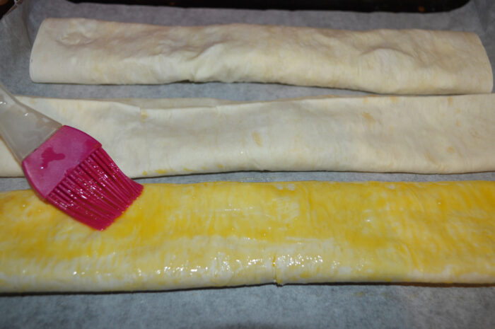 Grease the rolls with egg yolk