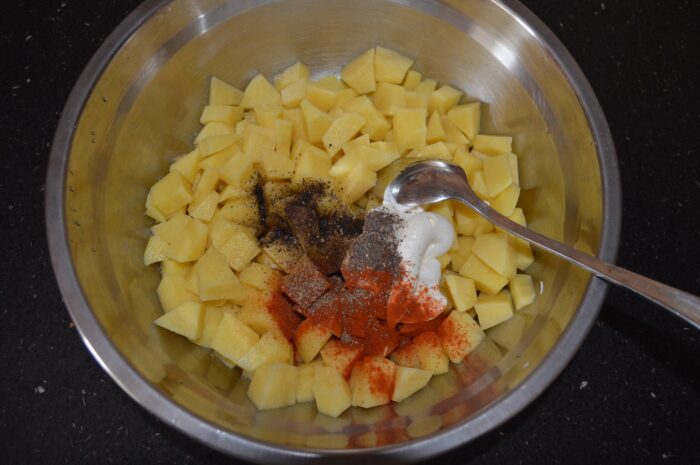 Peel the potatoes and cut