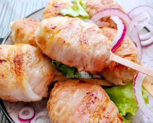 Bacon-wrapped patties fresh from the pan