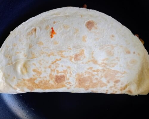 Fold the tortilla in half and fry