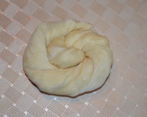 Roll out the dough to form a pie