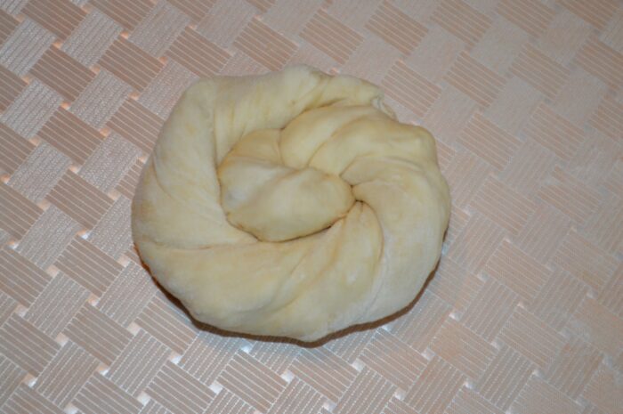 Roll out the dough to form a pie