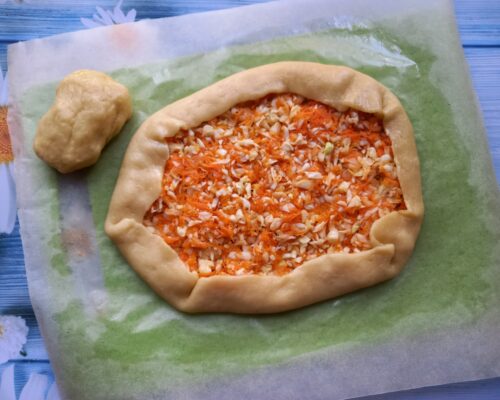 The free edges of the dough are brought up