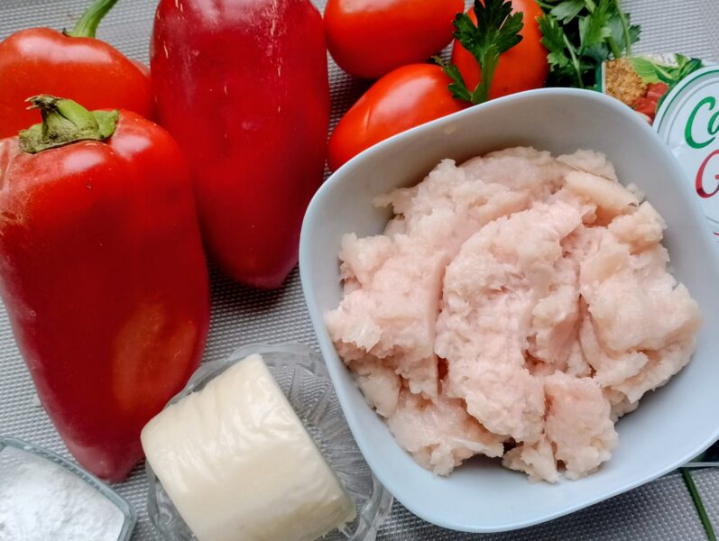 Ingredients laid out: bell peppers, minced meat, cheese, seasoning, tray