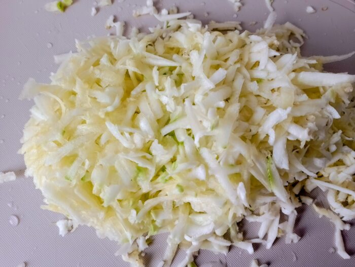 Clean the zucchini and grate