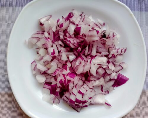 Peel the onion, wash it, and slice it thinly