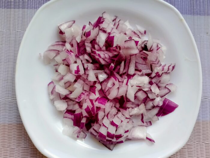 Peel the onion, wash it, and slice it thinly