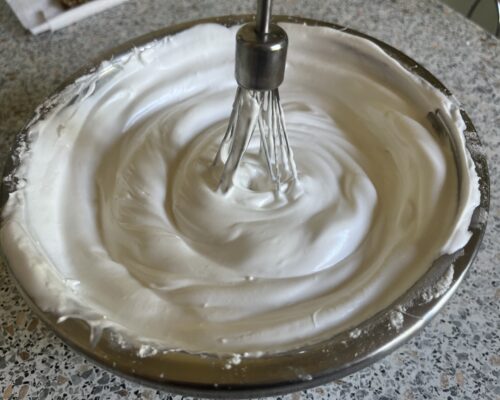 Start beating the egg whites