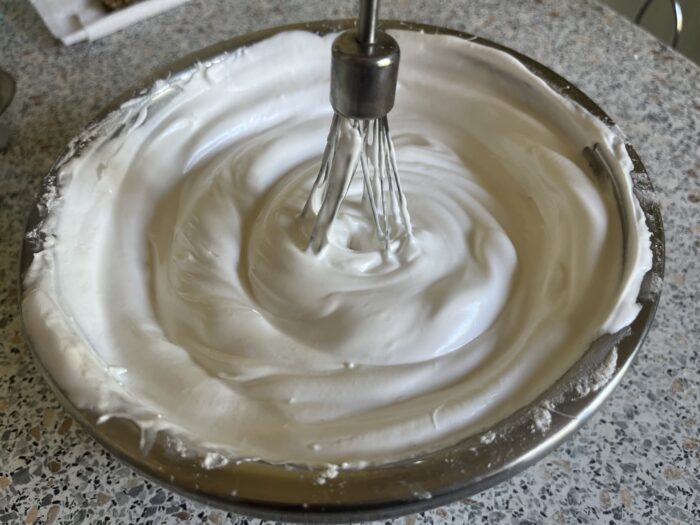 Start beating the egg whites