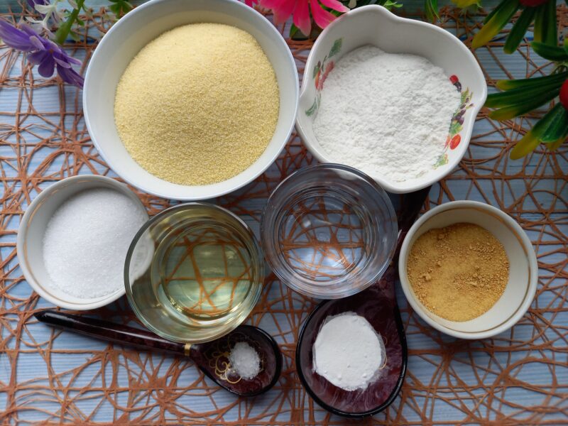 Ingredients laid out: semolina, rice flour, oil, lemon zest for vegan biscuits